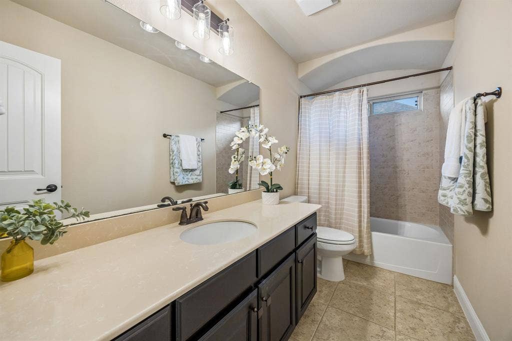 3702 Harlan Drive, Sachse, TX 75048 Full upstairs bathroom conveniently serves the fourth bedroom and game room.