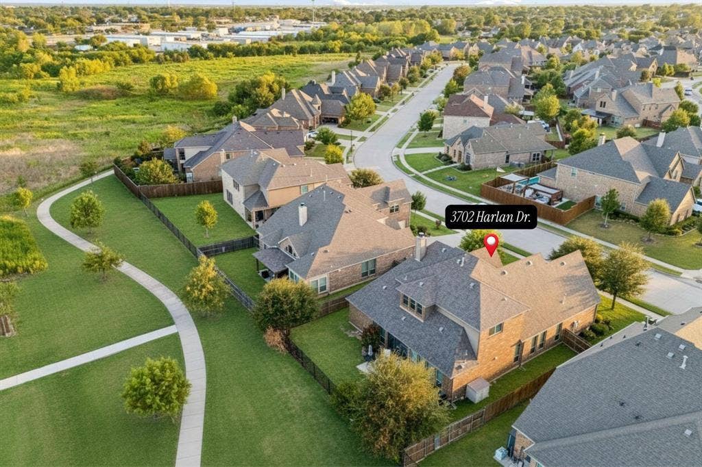 3702 Harlan Drive, Sachse, TX 75048 Elevated view highlights the greenbelt corridor directly behind the home and its connection to the surrounding community.