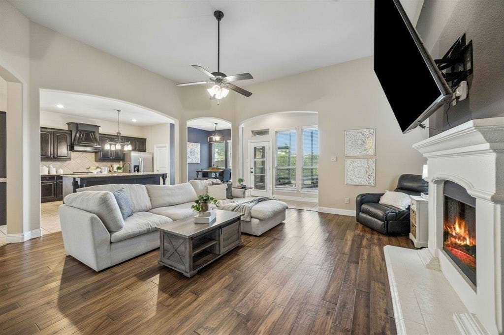 3702 Harlan Drive, Sachse, TX 75048 Another view of the open family room highlights the home's spacious layout and connection to the kitchen.