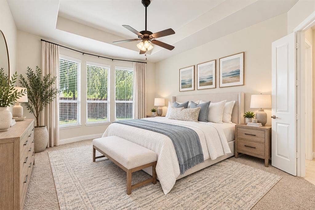 Large primary bedroom facing back yard and pool virtually staged