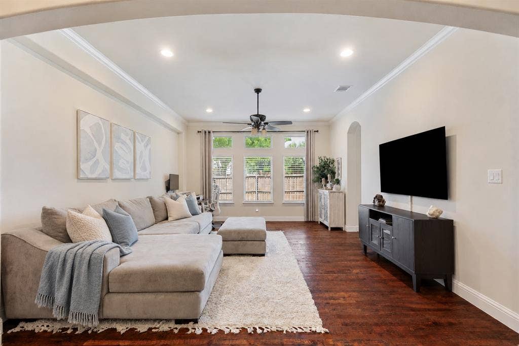 Secondary flexible room currently being used as an additional living room with a second desk