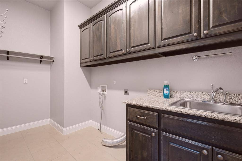 605 Brook Drive, Anna, TX 75409 oversized laundry with sink and cabinets