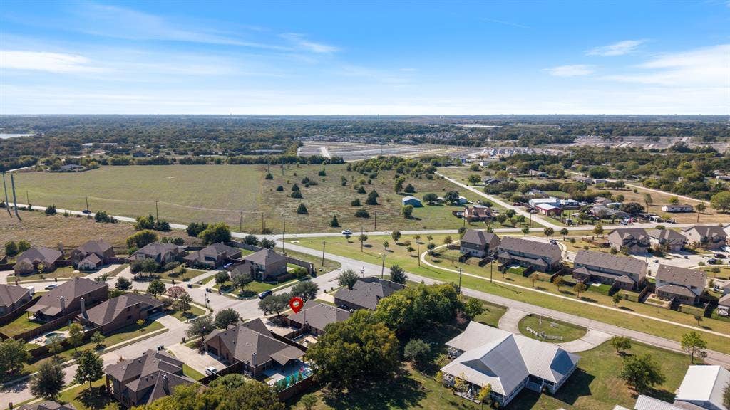 1802 Watermark Lane, Wylie, TX 75098 Aerial perspective featuring expansive residential surroundings, mature trees, and established infrastructure