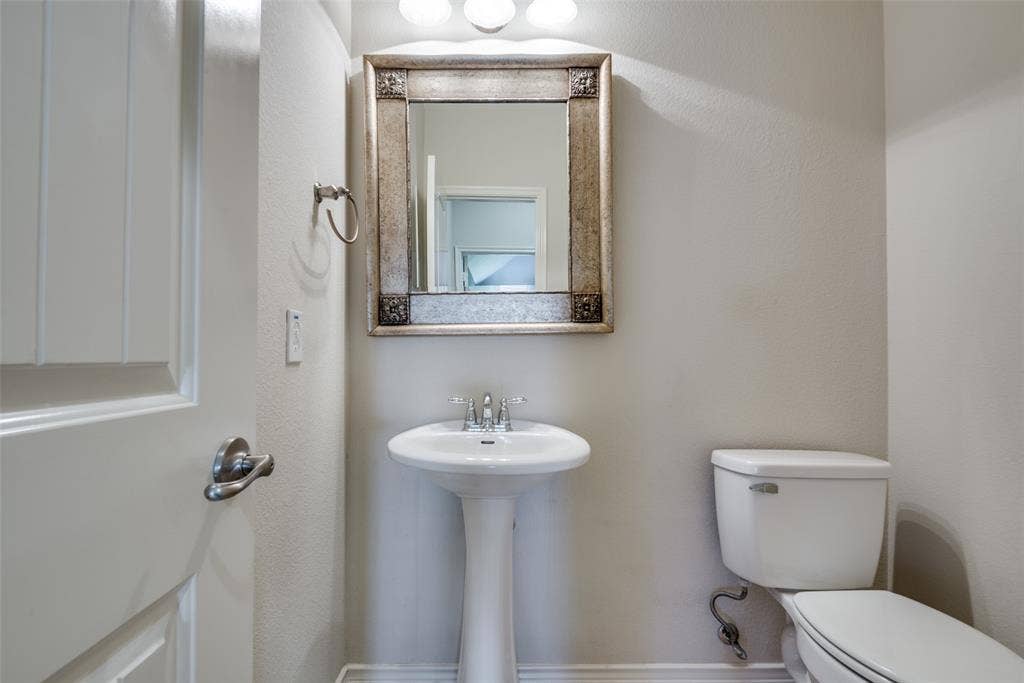 Half bath featuring toilet