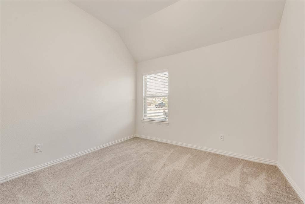 3934 Timberview Street, Midlothian, TX 76065 Room featuring neutral wall tones, carpeted flooring, and a vaulted ceiling with an inset window