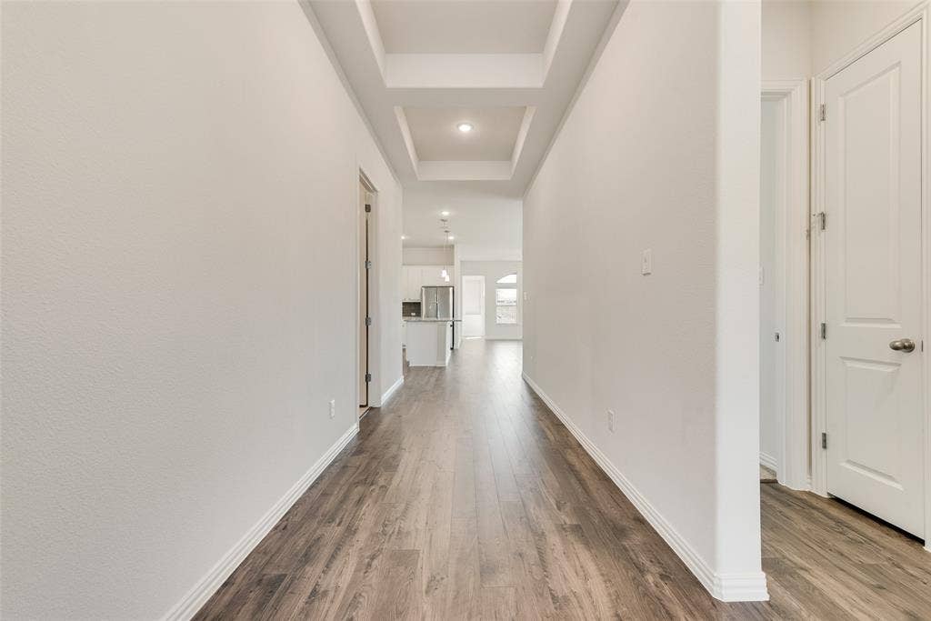 3934 Timberview Street, Midlothian, TX 76065 Hallway featuring coffered ceiling detail, wood-finish flooring, and recessed lighting