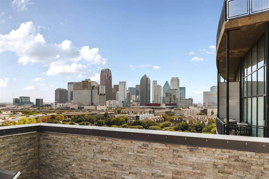 3110 Thomas Avenue, #717, Dallas, TX 75204 Stone veneer exterior wall with a metal cap