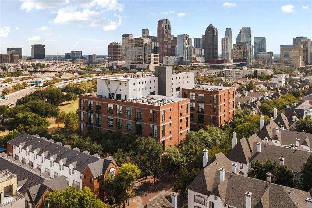 3110 Thomas Avenue, #717, Dallas, TX 75204 Expansive urban landscape featuring a dynamic skyline, a multi-lane highway, and varied residential architecture