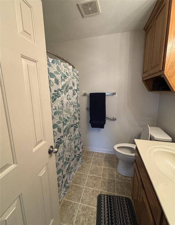 1 Mulberry Court, Morgans Point Resort, TX 76513 Bathroom featuring a vanity with wood-finish cabinetry, integrated sink, tiled flooring, wall-mounted grab bars, and an elevated storage cabinet
