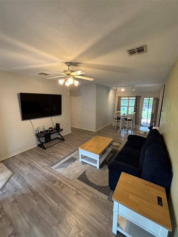 1 Mulberry Court, Morgans Point Resort, TX 76513 Open-concept interior featuring wood-finish flooring, and a multi-blade ceiling fan with integrated lighting.
