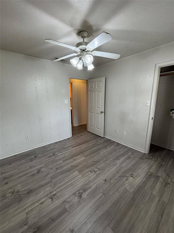 1 Mulberry Court, Morgans Point Resort, TX 76513 Room featuring wood-finish flooring, a neutral wall palette, and a multi-light ceiling fan.