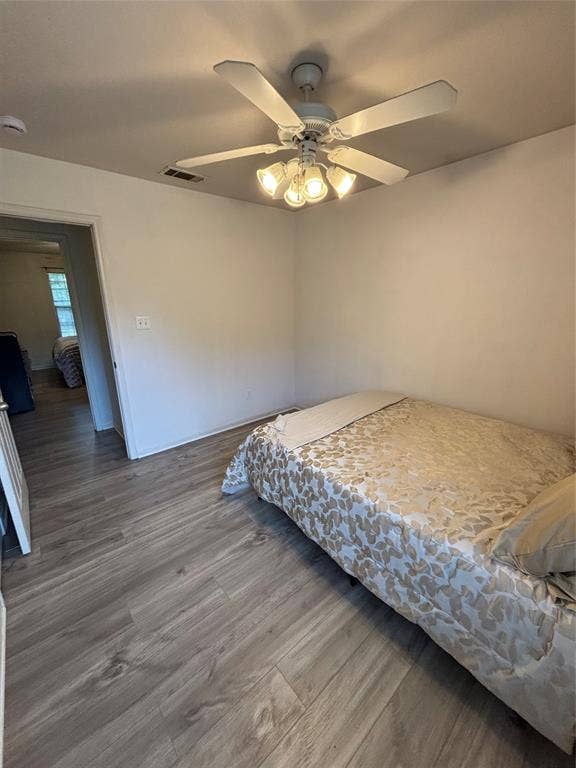 1 Mulberry Court, Morgans Point Resort, TX 76513 Room featuring wood-finish flooring, a white ceiling fan with integrated four-light fixture, and neutral wall paint