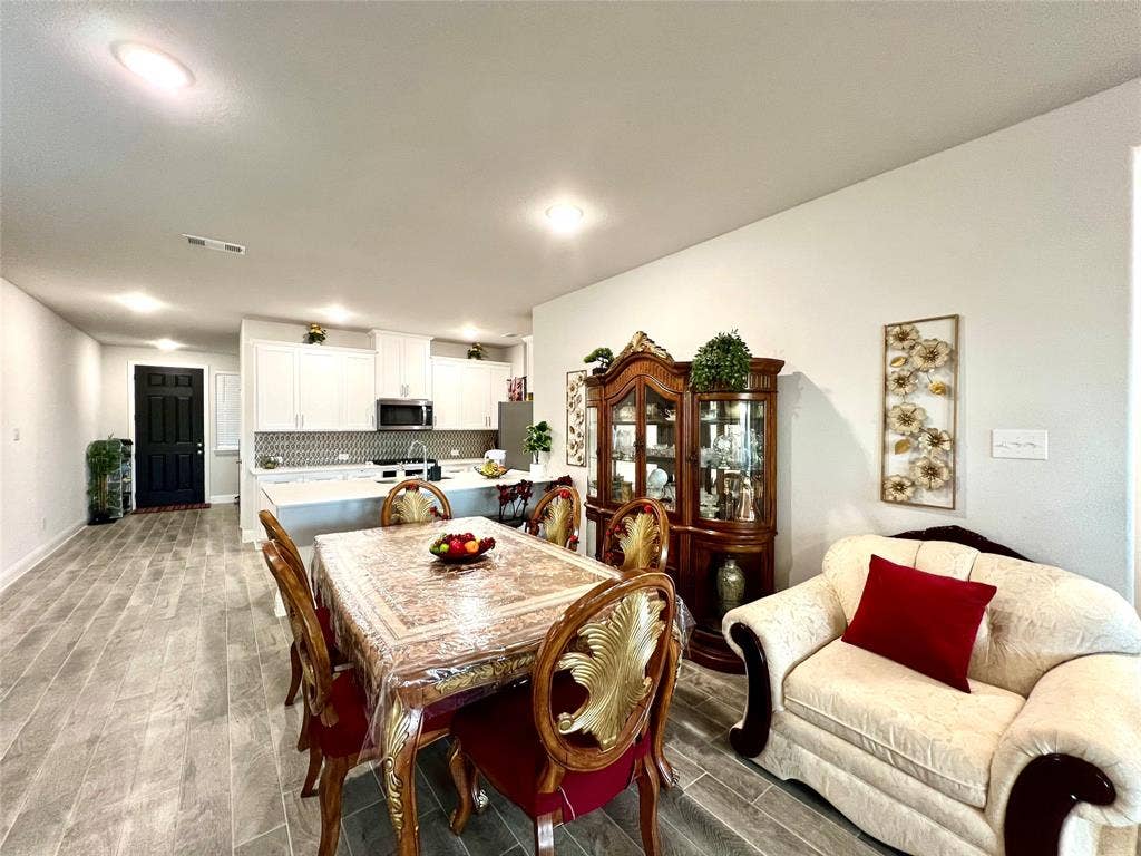 2707 Woodland Court, Wylie, TX 75098 Dining space with light wood-type flooring