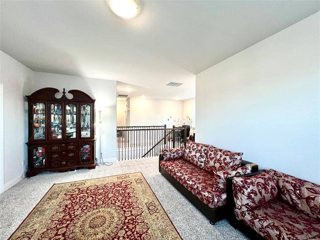 2707 Woodland Court, Wylie, TX 75098 Living room with carpet
