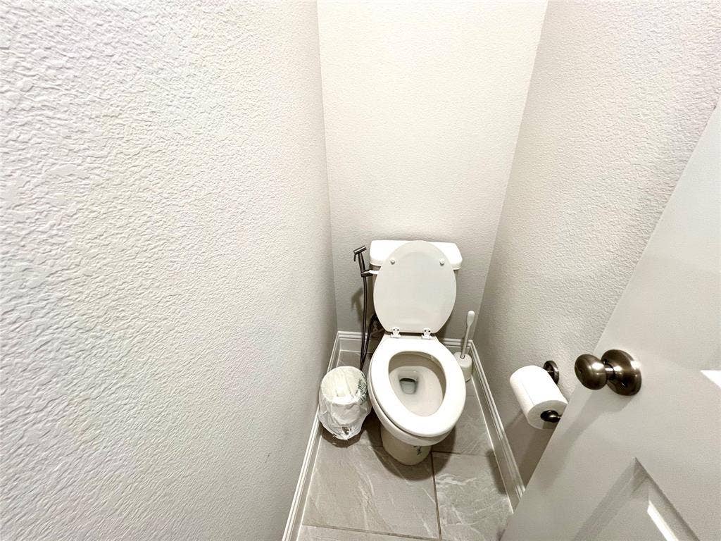 2707 Woodland Court, Wylie, TX 75098 Bathroom featuring toilet