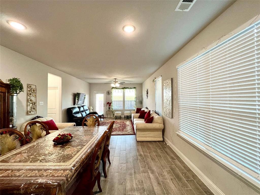 2707 Woodland Court, Wylie, TX 75098 Dining space featuring wood-type flooring and ceiling fan