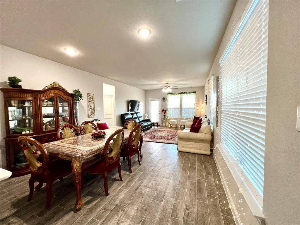 2707 Woodland Court, Wylie, TX 75098 Dining area featuring wood-type flooring and ceiling fan