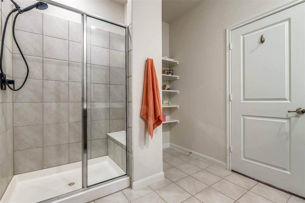 master bath with glass shower and linen shelf. Non furnished but some furniture is negotiable or case by case.