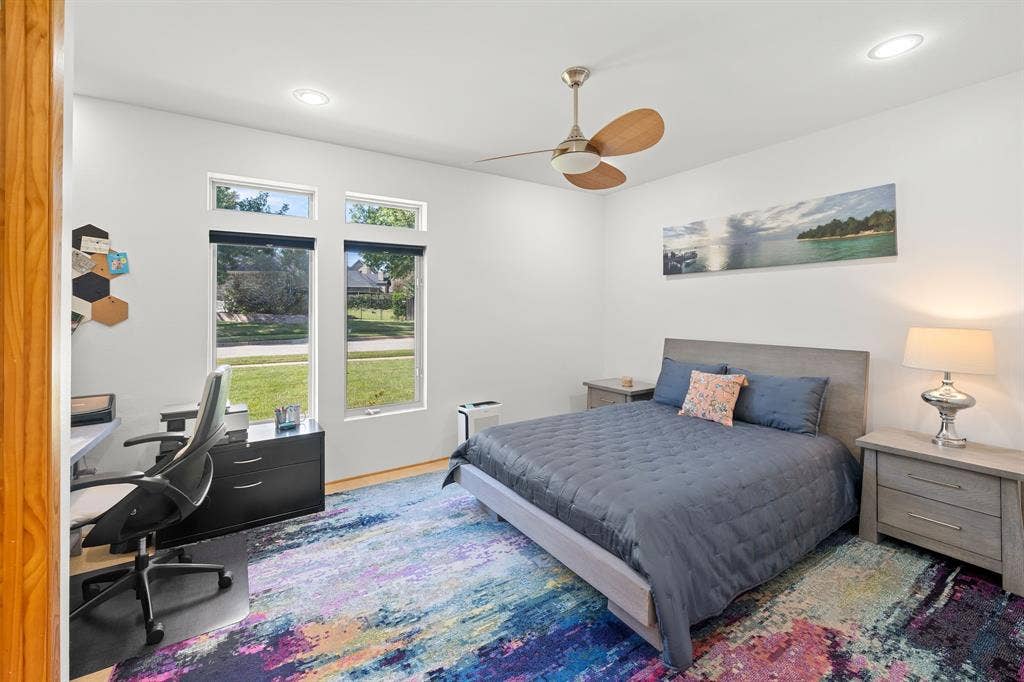 1997 Hollystone Drive, Tyler, TX 75703 Spacious room featuring tall windows, recessed lighting, and a ceiling fan with wood-finish blades