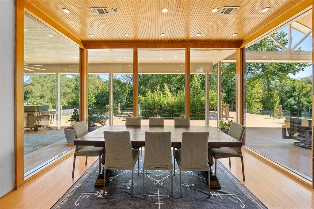 1997 Hollystone Drive, Tyler, TX 75703 Floor-to-ceiling glass walls, wood-paneled ceiling, recessed lighting, and wood-finish flooring