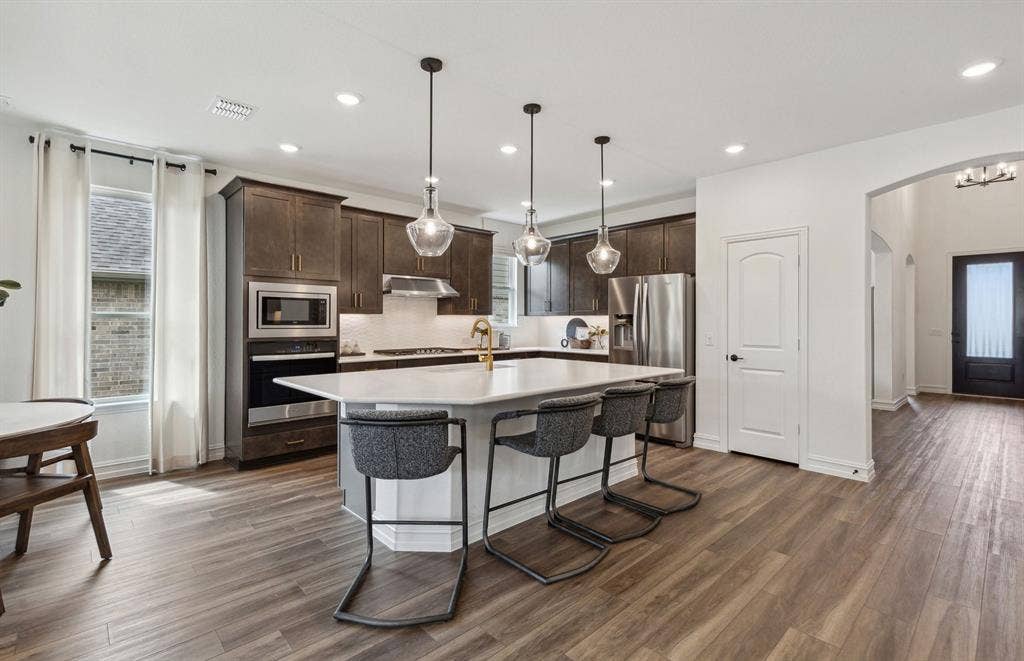 1437 Corleone Lane, Celina, TX 75009 *Model Representation - Spacious kitchen with eat-in bartop island