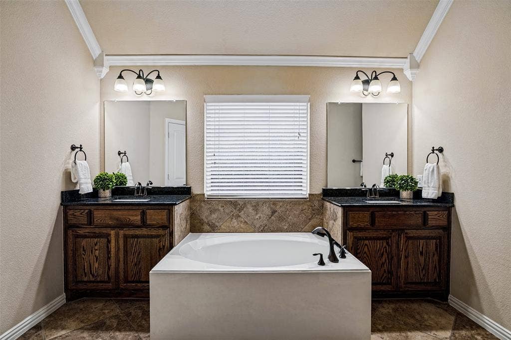 8303 Lake Valley Court, Rowlett, TX 75089 Dual vanities, large soaking tub, dual closets and separate walk in shower. Linen closet