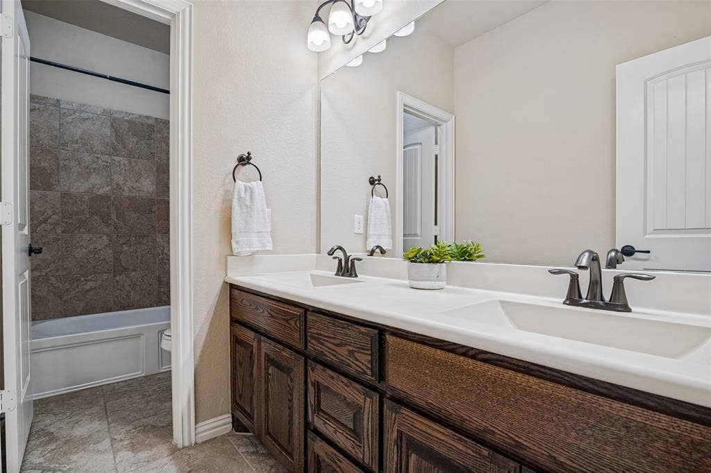 8303 Lake Valley Court, Rowlett, TX 75089 guest Bathroom with dual sinks