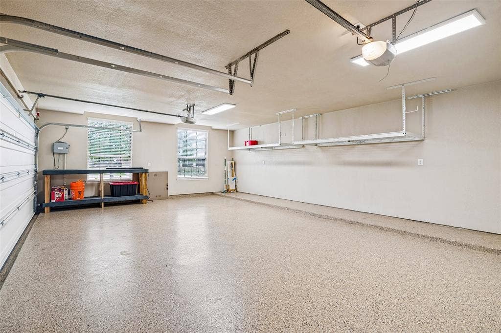 8303 Lake Valley Court, Rowlett, TX 75089 3 Car Garage with Expoxy Flooring and extra storage racks