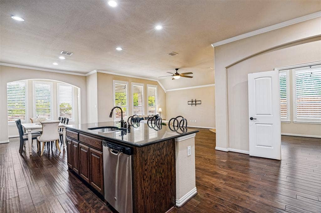 8303 Lake Valley Court, Rowlett, TX 75089 Stunning oversized Kitchen has Great Island, stainless appliances, including gas cooktop.