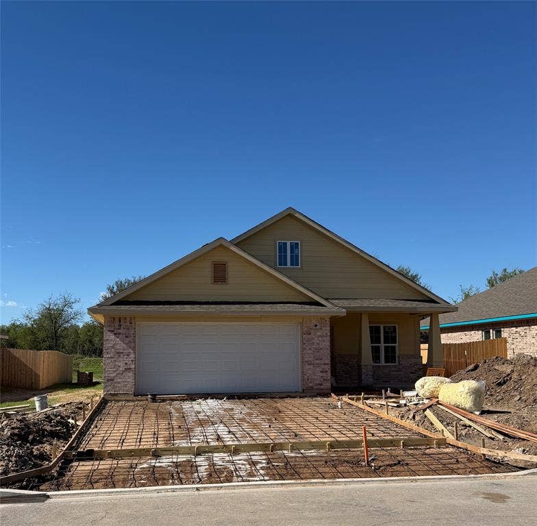 415 Conway, Lacy Lakeview, TX 76705 Single-story residence featuring a combination of brick and lap siding exterior, a two-car garage, and a covered front porch entry
