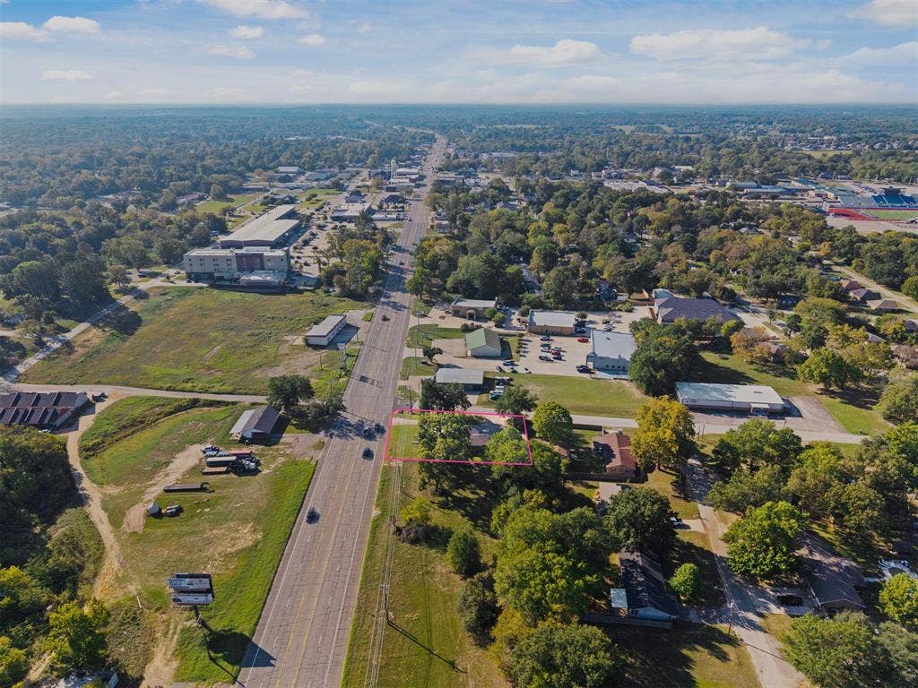 700 N Main Street, Lindale, TX 75771 Aerial perspective of a parcel featuring direct street frontage, mature trees, and established landscape