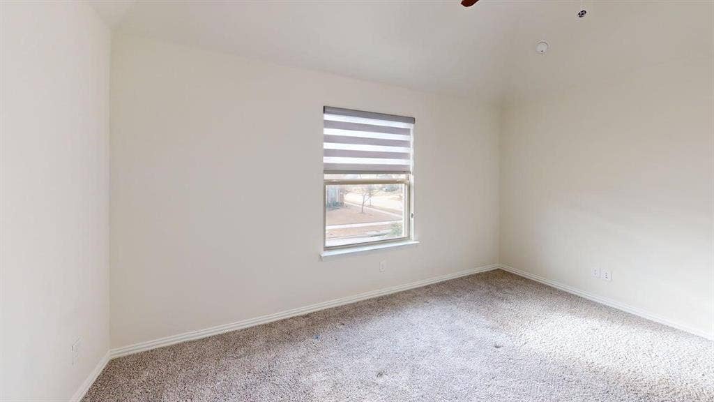 14518 Shady Grove Lane, Frisco, TX 75035 Vaulted ceiling, wall-to-wall carpeting, and window with light-filtering roller shades