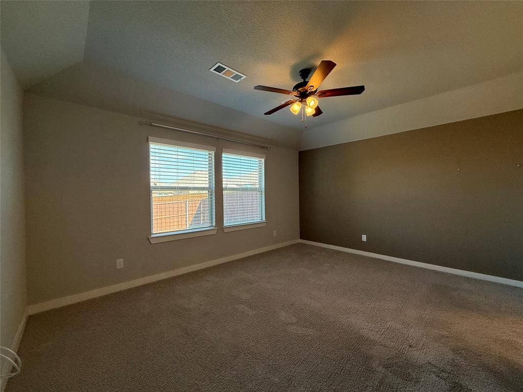 1702 Sagebrush Trail, Wylie, TX 75098 Tray ceiling, dual-tone wall finishes, wall-to-wall carpeting, and a central ceiling fan with integrated lighting
