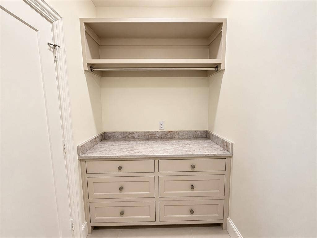 Laundry folding area with tons of storage.