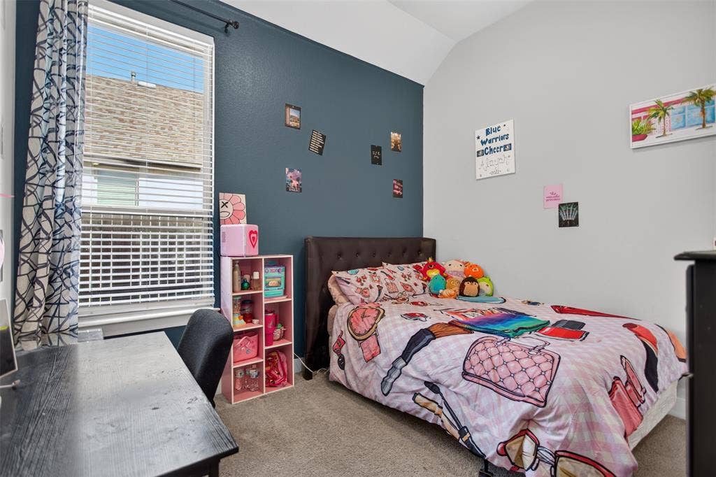 1103 Walford Drive, Forney, TX 75126 Room featuring high vaulted ceilings, a single deep-toned accent wall, neutral carpeting, and a large window with horizontal blinds