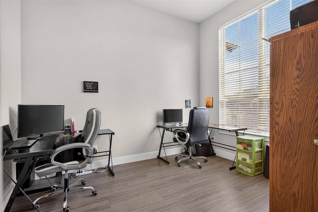 1103 Walford Drive, Forney, TX 75126 Wood-finish flooring and a large window with horizontal blinds