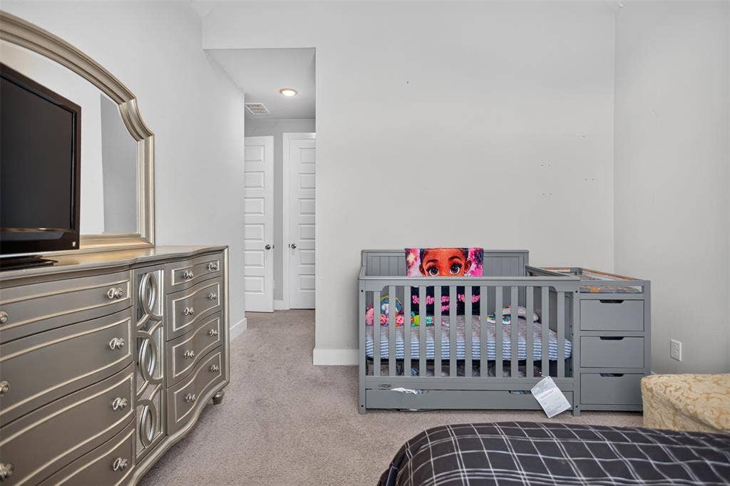 1103 Walford Drive, Forney, TX 75126 Neutral-toned interior featuring wall-to-wall carpeting, recessed lighting, and two multi-panel doors