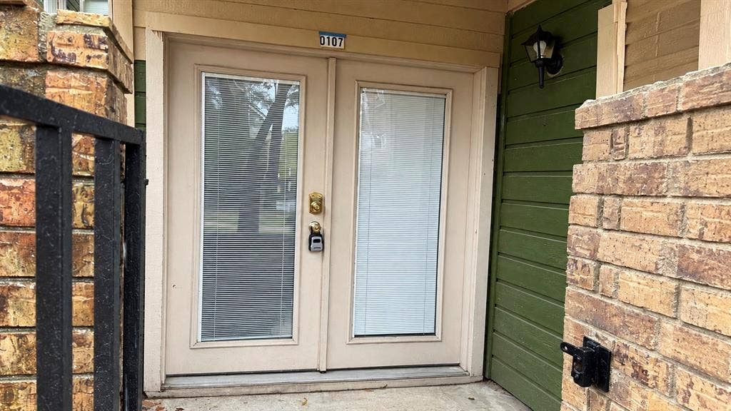 Gated covered front Patio with storage closet