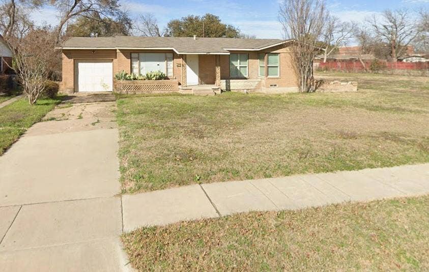 427 Pittman Street, Richardson, TX 75081 Single-story brick exterior featuring a recessed entryway, attached one-car garage, and concrete driveway