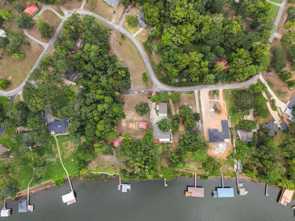 15993 Big Oak Bay Road, Tyler, TX 75707 Waterfront lot featuring mature tree canopy, direct shoreline access, and private deep-water dock