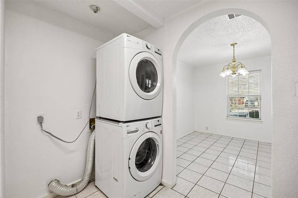 Laundry located in the kitchen.