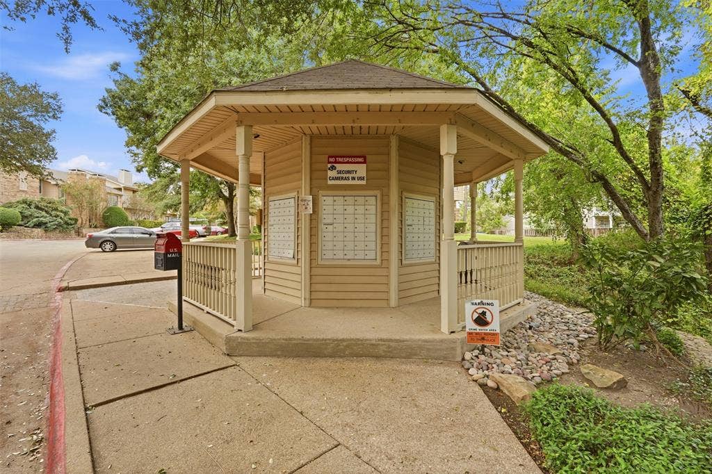 14333 Preston Road, #806, Dallas, TX 75254 Octagonal outdoor pavilion featuring wood-finish siding, a covered walkway, and built-in mail compartments