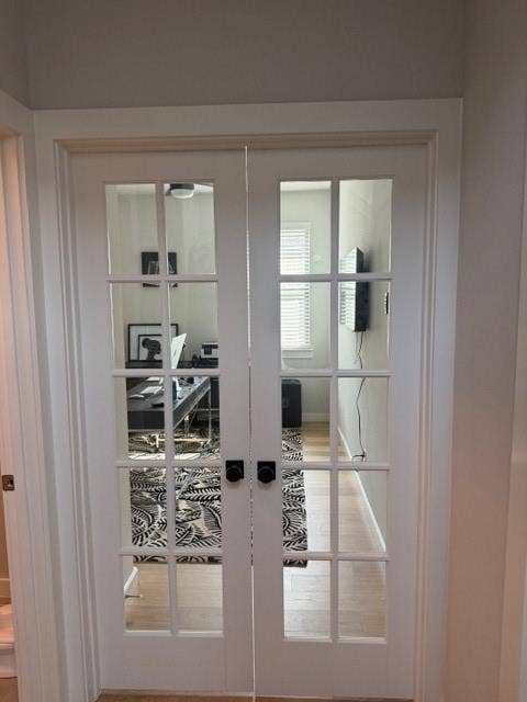 2416 Adenmore Lane, Forney, TX 75126 White French doors featuring a ten-pane glass design and matte black hardware