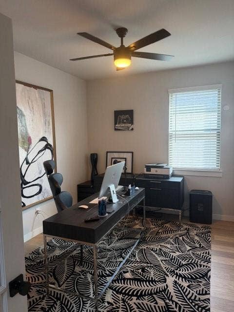 2416 Adenmore Lane, Forney, TX 75126 Neutral wall palette featuring wood-finish flooring, a multi-blade ceiling fan with integrated lighting, and a window with horizontal blinds