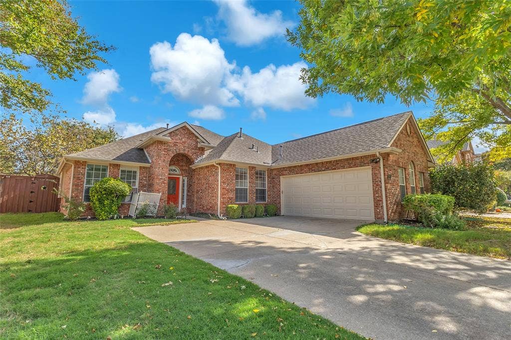 Front exterior with driveway and attached 2-car garage — 5804 Lafayette Dr, Frisco