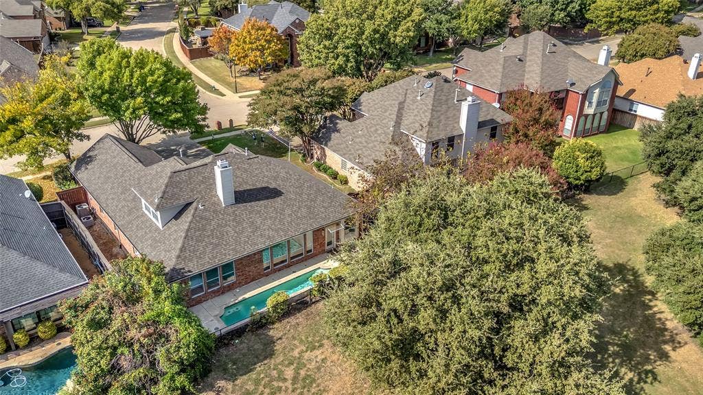 Aerial view of the home and pool backing to the open golf course — 5804 Lafayette Dr, Frisco