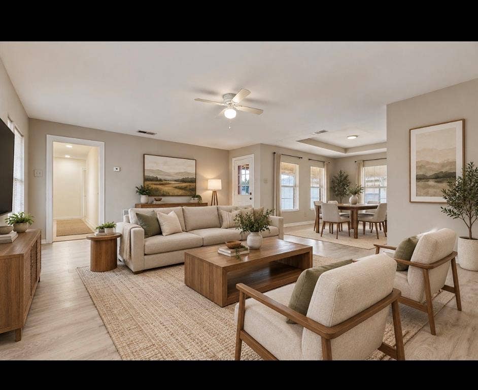 6719 Kenwell Street, Dallas, TX 75209 Open-concept interior featuring light wood-finish flooring, recessed lighting, neutral wall paint, and a tray ceiling- *virtually staged*