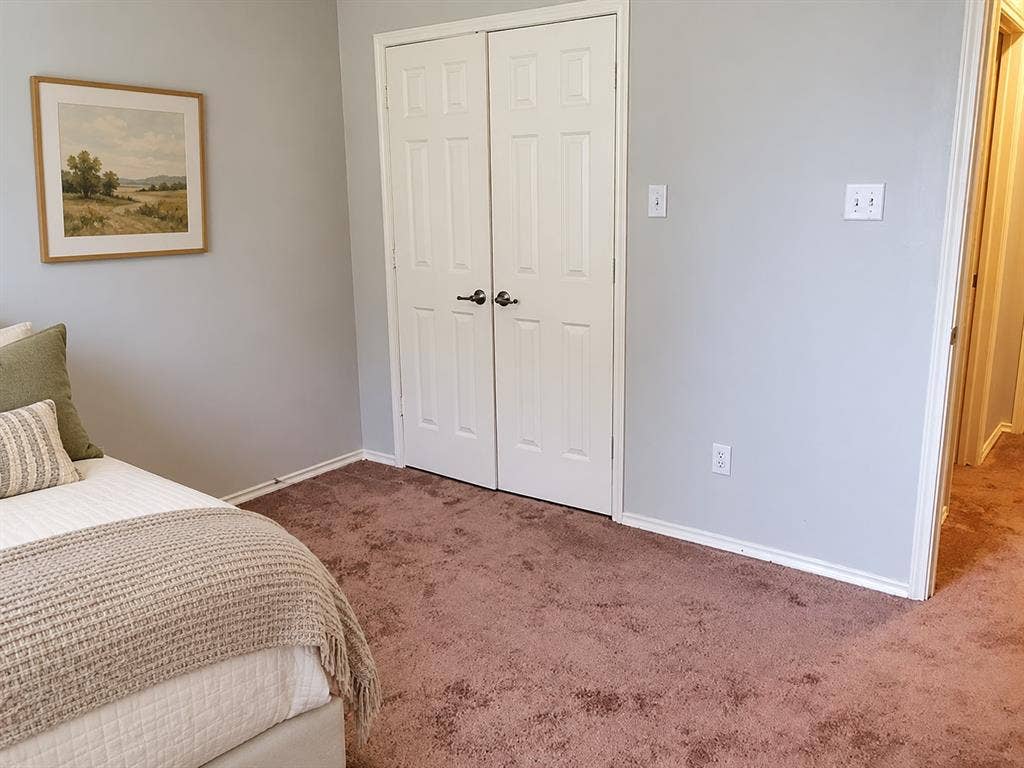 462 Pittman Street, Richardson, TX 75081 Interior room featuring plush carpeting, neutral wall paint, and a double-door closet with brushed nickel hardware