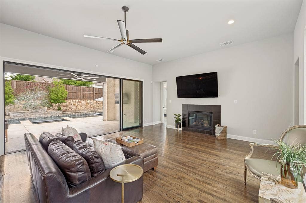 1730 Cottonwood Trail, Prosper, TX 75078 Glass sliding wall allows you to enjoy both spaces at once. There are 3 entry points to the patio creating great flow in the home.