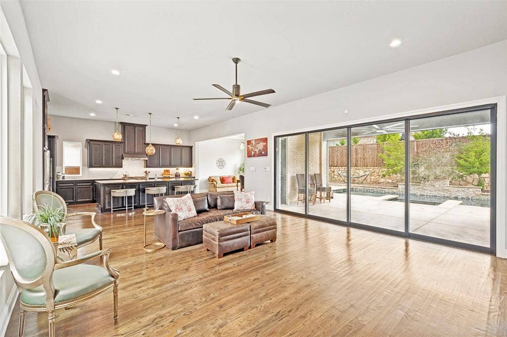 1730 Cottonwood Trail, Prosper, TX 75078 Spacious open living area with pocketed glass sliding wall.